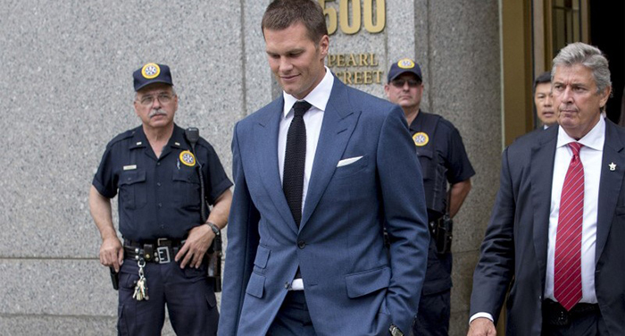 A photo of Tom Brady exiting the courthouse